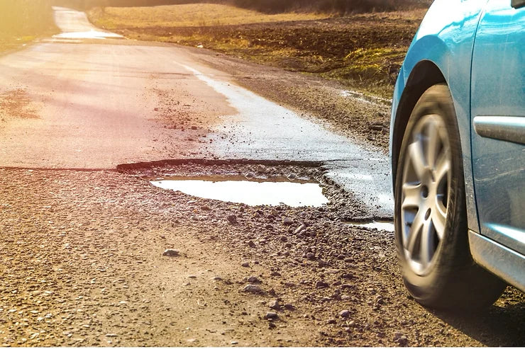 Potholes wreak havoc on your wheels suspension and steering